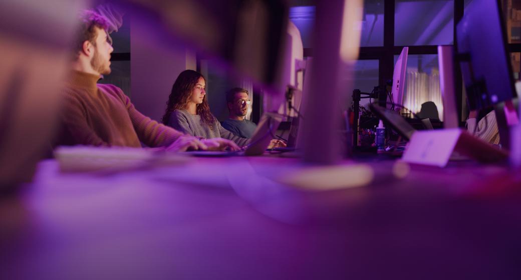 A view of customer support professionals at their work stations.